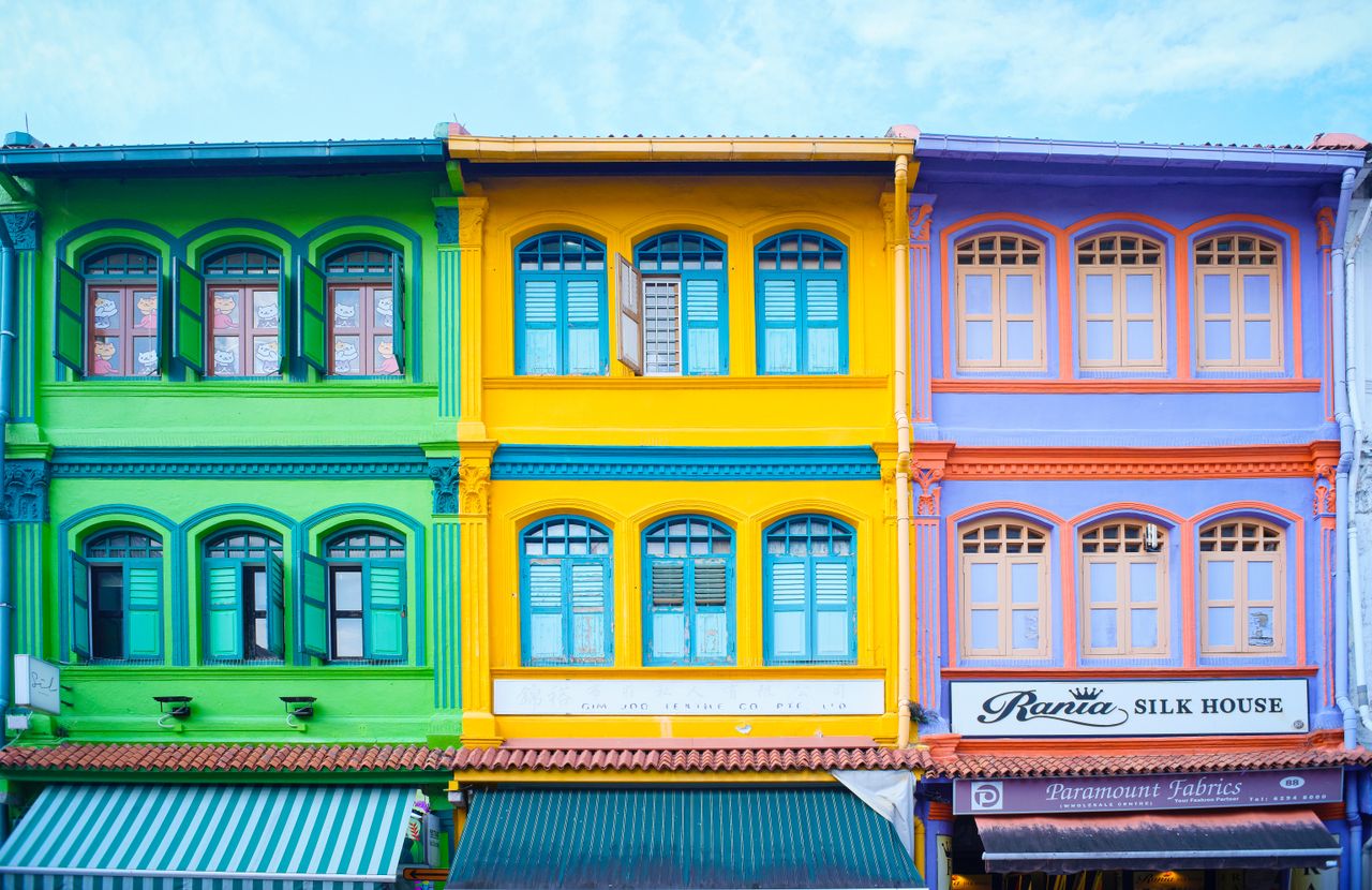 Vibrant colonial-era shophouses in Singapore featuring bright colors and traditional architecture.